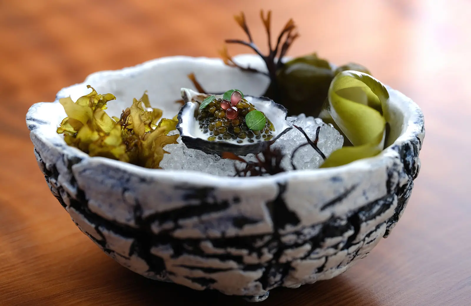 Plated dish at Aubergine, Carmel's Michelin-starred restaurant
