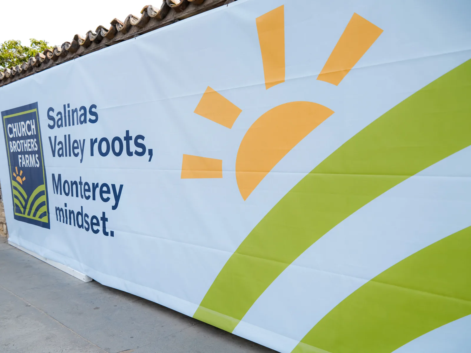 Church Brothers Farms banner reading Salinas Valley roots, Monterey mindset at the company event at The Barns at Cooper Molera, Monterey