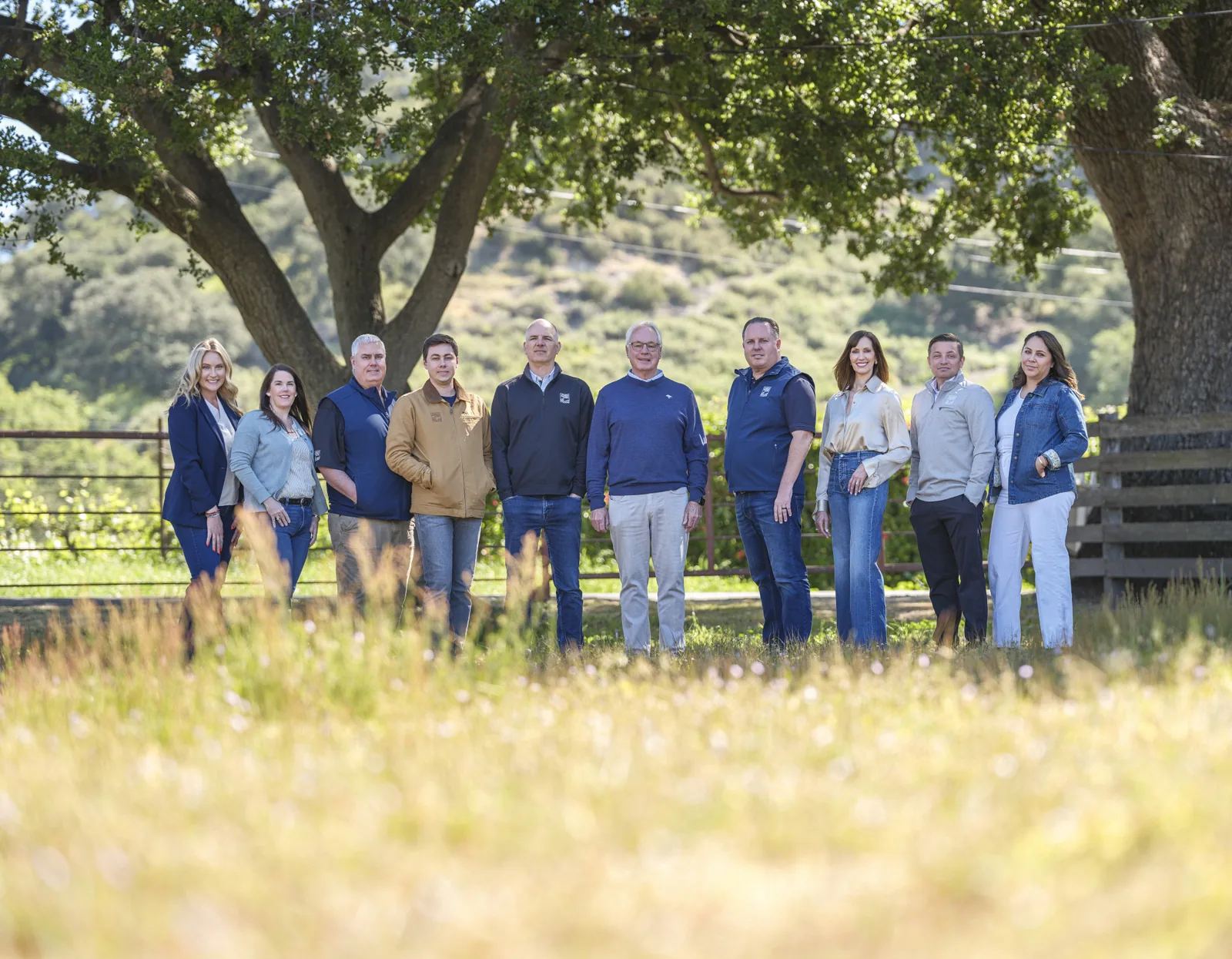 Church Brothers Farms leadership team standing in a golden field under oaks on the ranch, Salinas Valley, photographed for The Snack magazine by Manny Espinoza