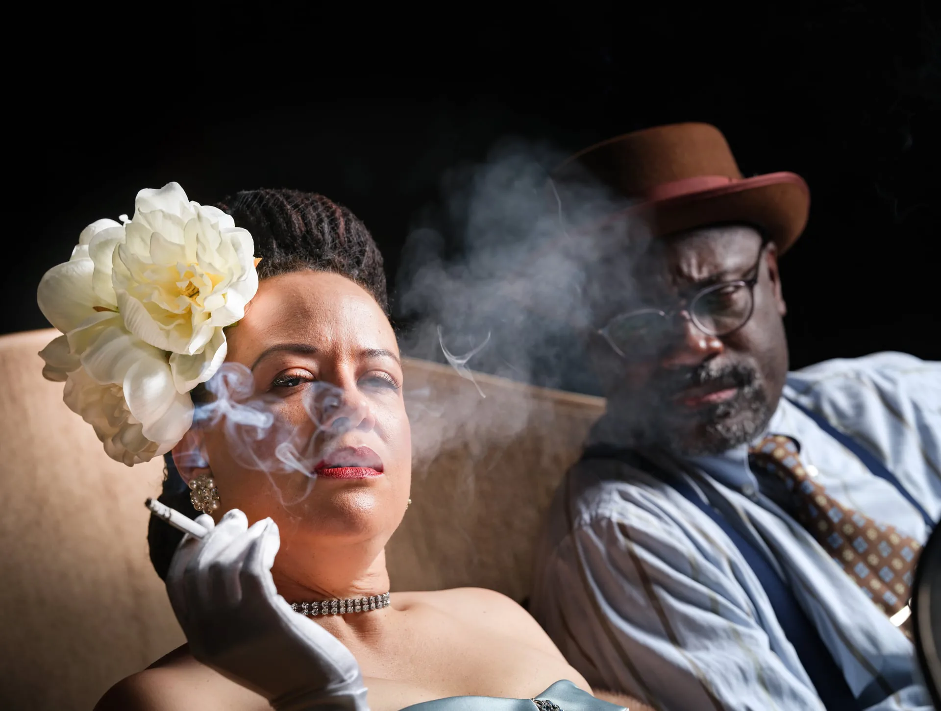 Theatrical editorial photograph for New Canon Theatre Co.'s Lady Day — actress with white flower exhaling smoke, photographed by Manny Espinoza