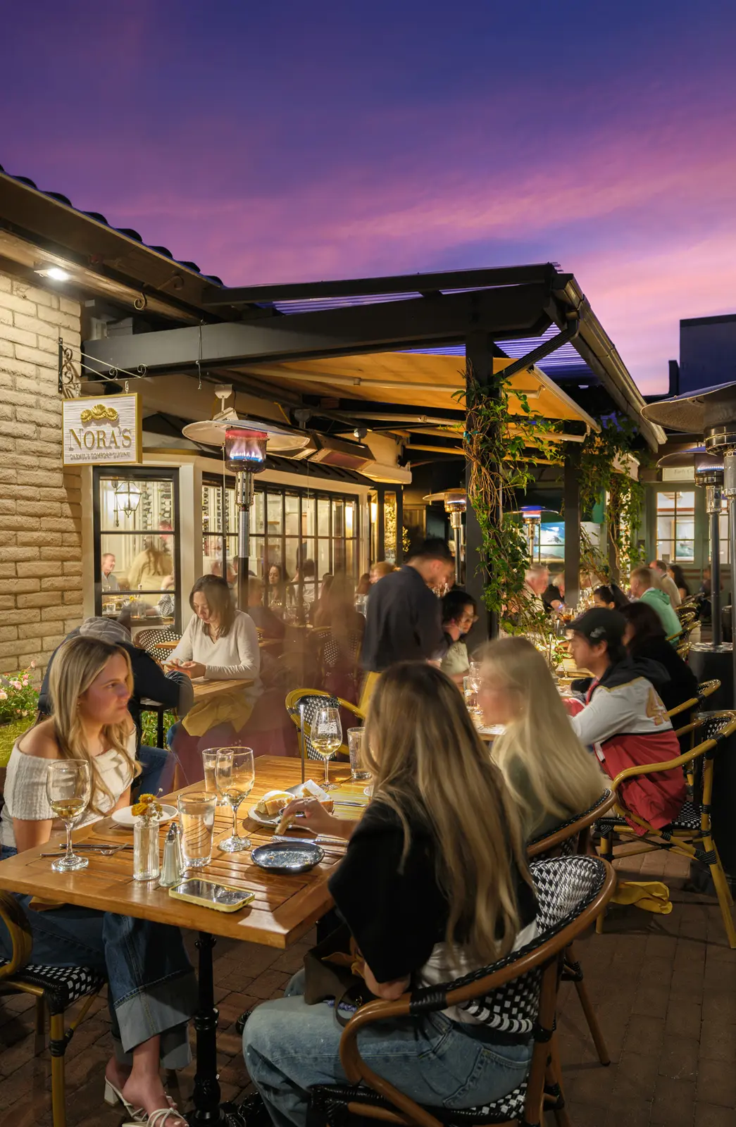 Twilight outdoor dining at Nora's — restaurant photography for 65º Magazine by Manny Espinoza
