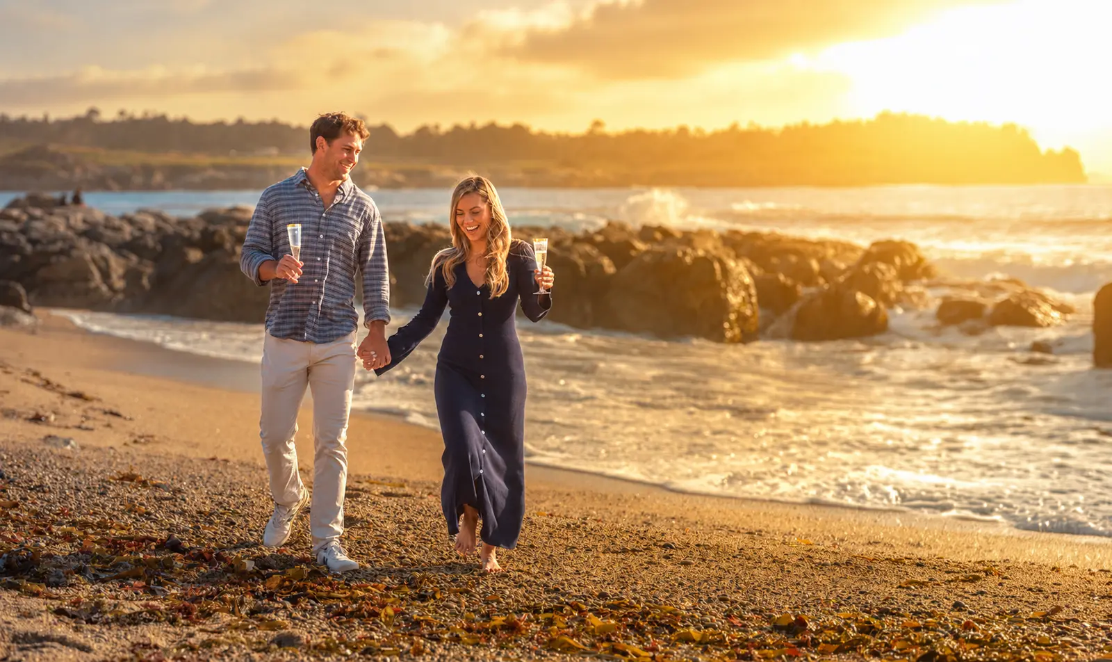 Couple walking Ribera Beach at sunset after a Carmel proposal, photographed by Manny Espinoza