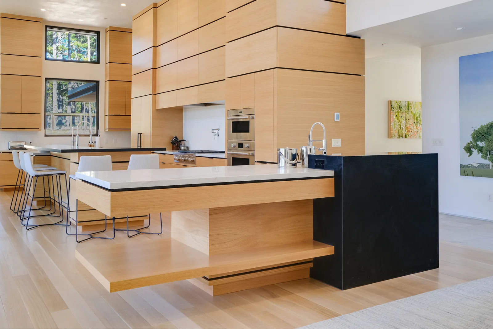 Staged modern kitchen with a long island, real estate photography on the Monterey Peninsula