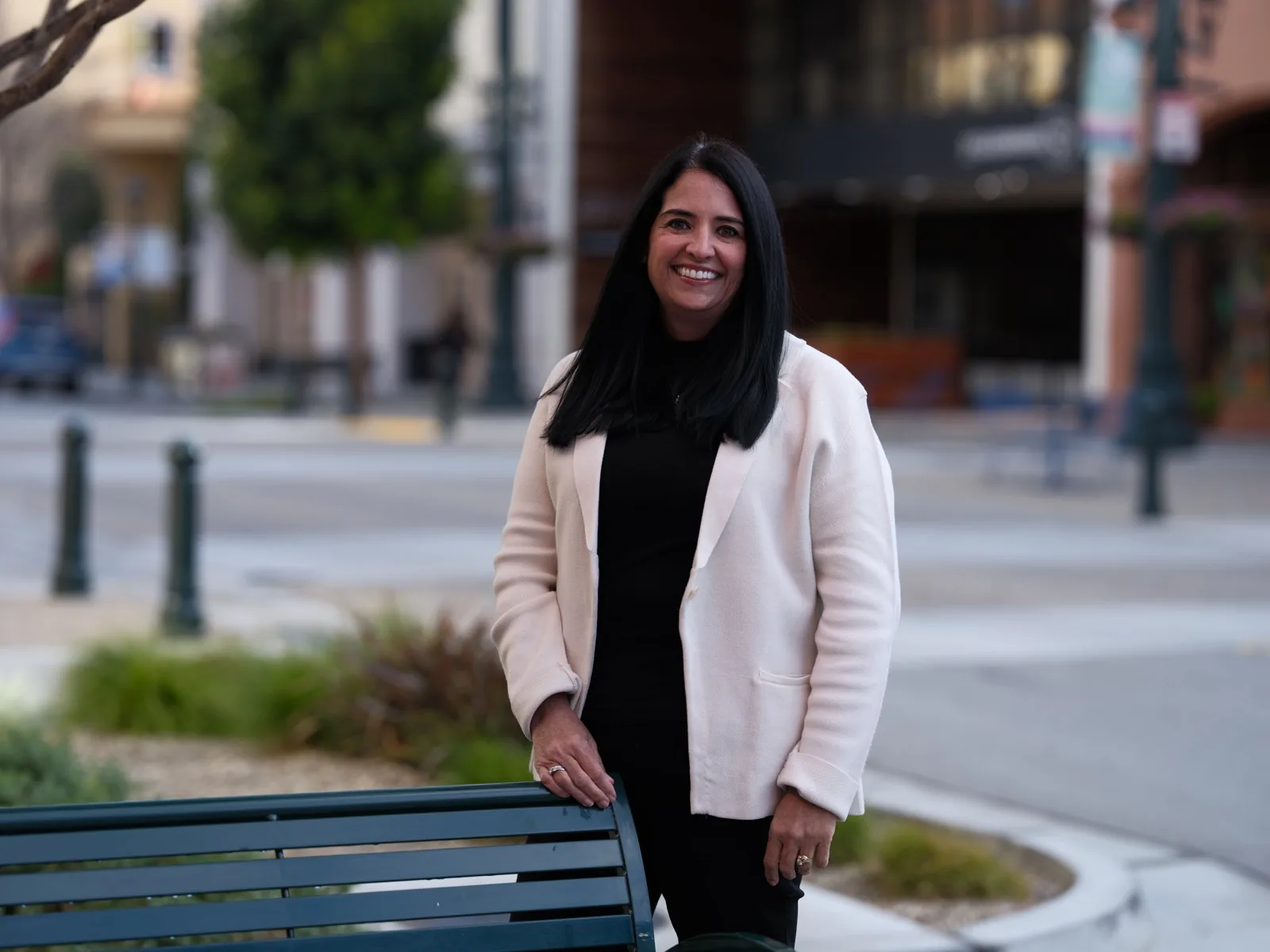 Sysco executive seated on a bench on Main Street in Oldtown Salinas, individual portrait by Manny Espinoza