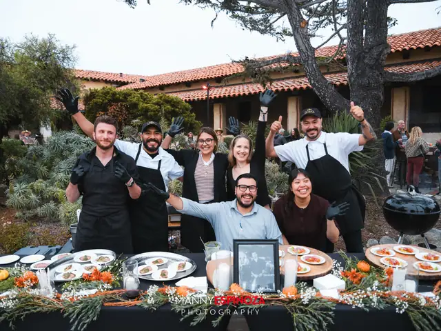 Restaurant team cheering behind a seafood and oyster display at Taste of Carmel 2026