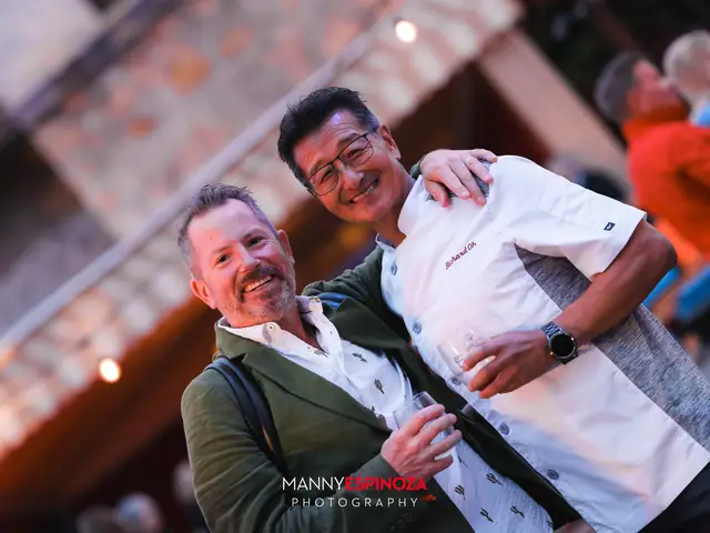 A chef in whites joking with a guest at Taste of Carmel 2026