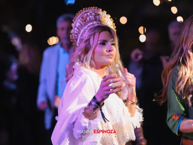 Woman in an ornate white headdress and ruffled blouse at Taste of Carmel 2026