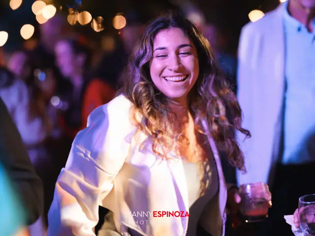 A guest laughing while dancing at Taste of Carmel 2026