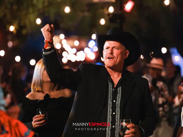 Man in a black cowboy hat cheering while dancing at Taste of Carmel 2026