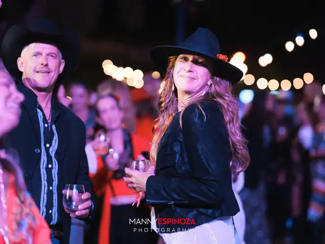 Couple in cowboy hats dancing at Taste of Carmel 2026