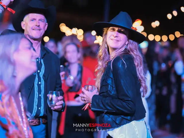 Couple in cowboy hats dancing at Taste of Carmel 2026