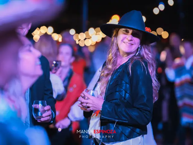 Woman in a black cowboy hat dancing at Taste of Carmel 2026