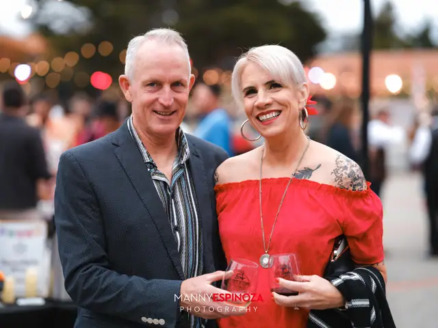 Guests posing for a portrait in the Carmel Mission courtyard at golden hour at Taste of Carmel 2026