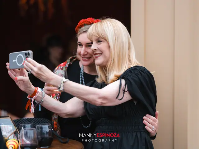 Two women in flower crowns taking a selfie at Taste of Carmel 2026