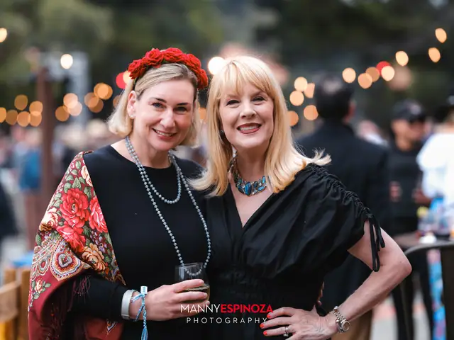 Two women in flower crowns posing together at Taste of Carmel 2026