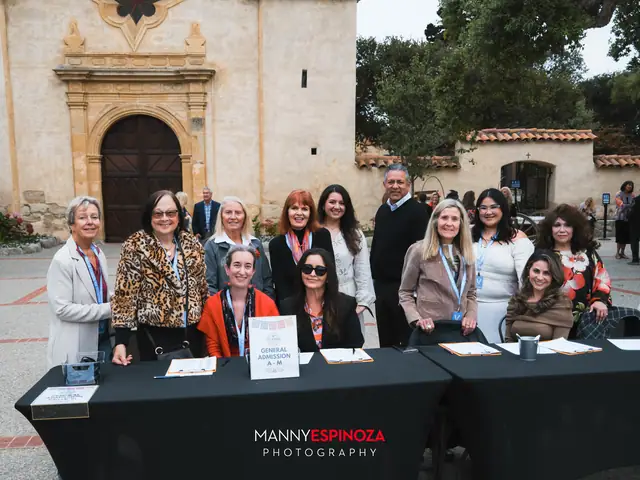 Carmel Chamber volunteers at the check-in table in front of the Carmel Mission at Taste of Carmel 2026