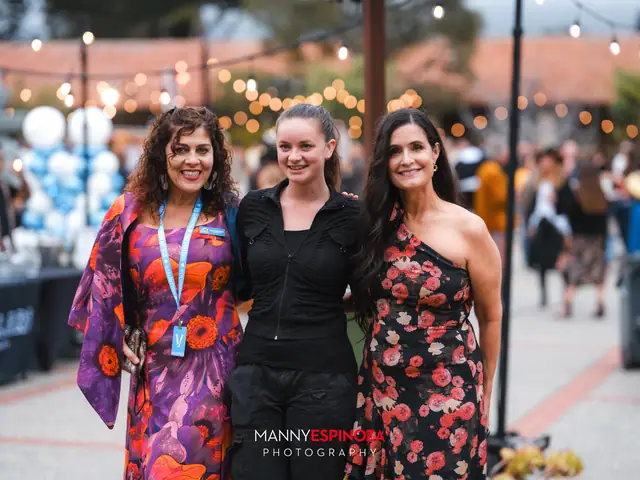Guests posing for a portrait in the Carmel Mission courtyard at golden hour at Taste of Carmel 2026