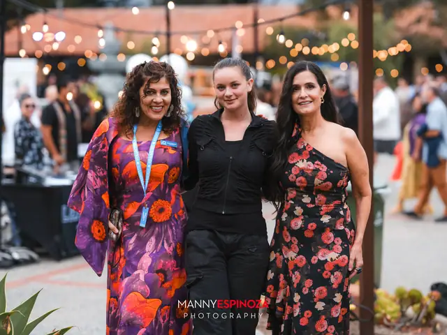 Guests posing for a portrait in the Carmel Mission courtyard at golden hour at Taste of Carmel 2026