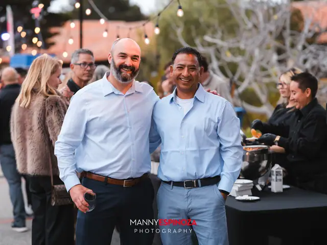 Guests posing for a portrait in the Carmel Mission courtyard at golden hour at Taste of Carmel 2026