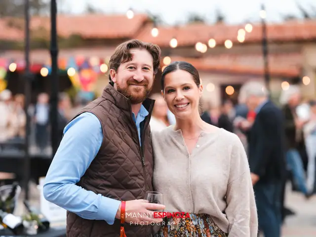 Guests posing for a portrait in the Carmel Mission courtyard at golden hour at Taste of Carmel 2026