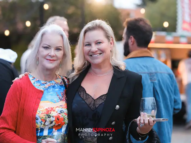 Guests posing for a portrait in the Carmel Mission courtyard at golden hour at Taste of Carmel 2026