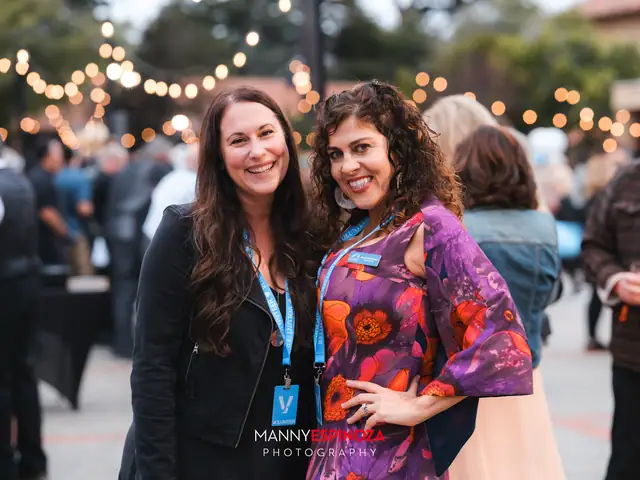 Guests posing for a portrait in the Carmel Mission courtyard at golden hour at Taste of Carmel 2026