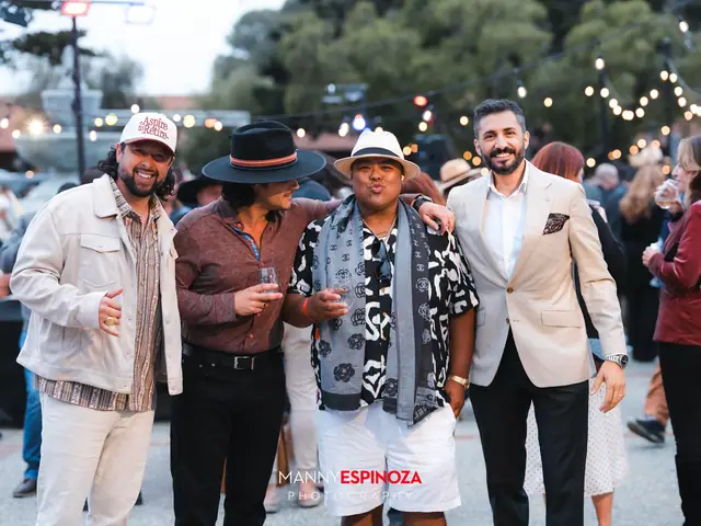 Guests posing for a portrait in the Carmel Mission courtyard at golden hour at Taste of Carmel 2026
