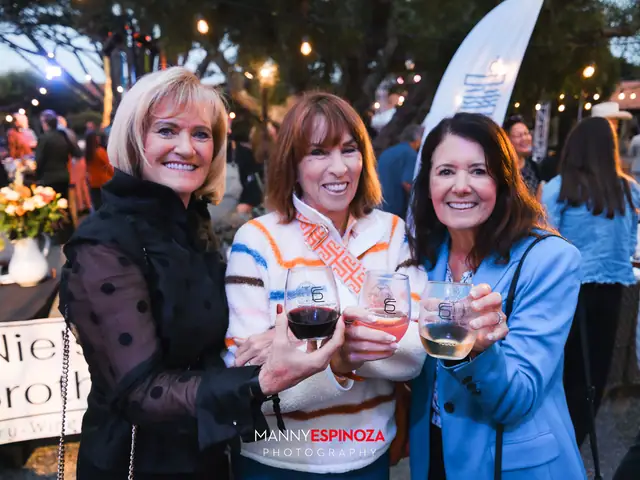 Three women toasting with wine glasses at Taste of Carmel 2026
