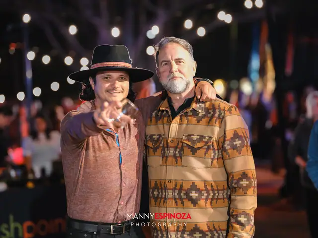 Guests posing for a portrait in the Carmel Mission courtyard at night at Taste of Carmel 2026