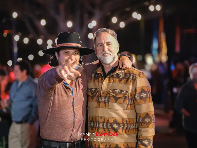 Guests posing for a portrait in the Carmel Mission courtyard at night at Taste of Carmel 2026