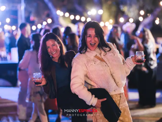 Guests posing for a portrait in the Carmel Mission courtyard at night at Taste of Carmel 2026