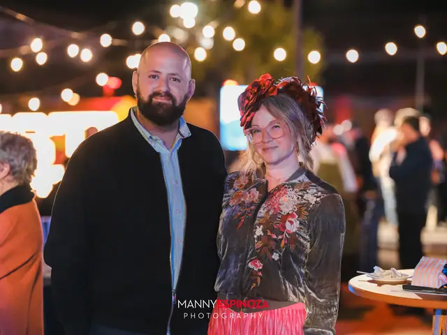 Couple posing at night, the woman wearing a flower crown, at Taste of Carmel 2026