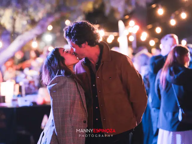 Couple sharing a kiss among string lights at Taste of Carmel 2026