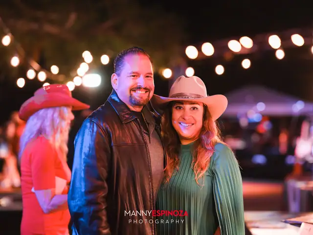 Couple in cowboy hats under string lights at Taste of Carmel 2026