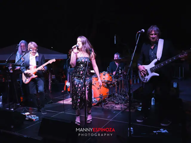 Singer and band performing on stage at night during Taste of Carmel 2026