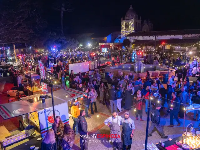 Elevated view of the crowd, vendor booths and string lights in the Carmel Mission courtyard at Taste of Carmel 2026