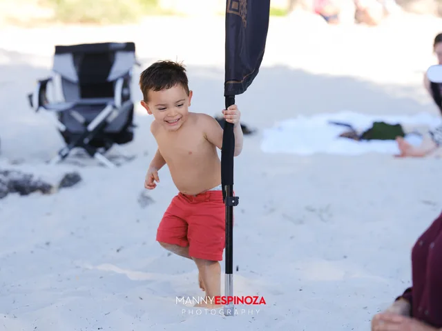 A boy running across the sand at Walk for Freedom 2026 on Carmel Beach