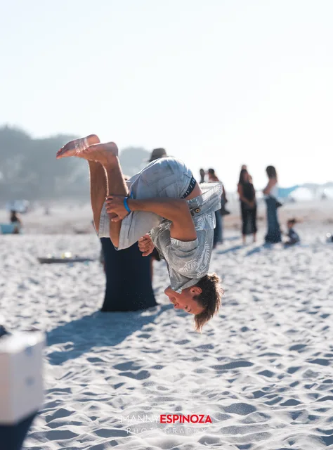 A guest doing a cartwheel on the beach at Walk for Freedom 2026 on Carmel Beach