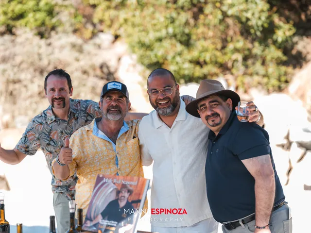 Four men posing in front of the rocks at Walk for Freedom 2026 on Carmel Beach