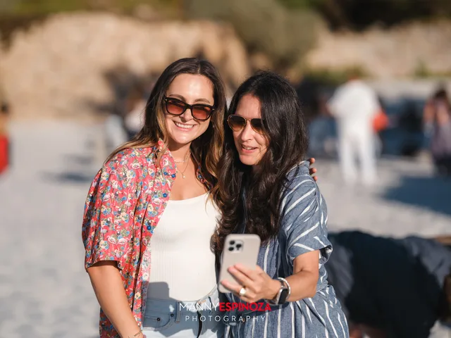 Two women taking a selfie as the afternoon ends at Walk for Freedom 2026 on Carmel Beach