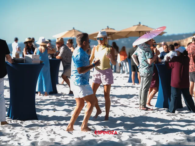 Guests mingling between the cocktail tables at Walk for Freedom 2026 on Carmel Beach