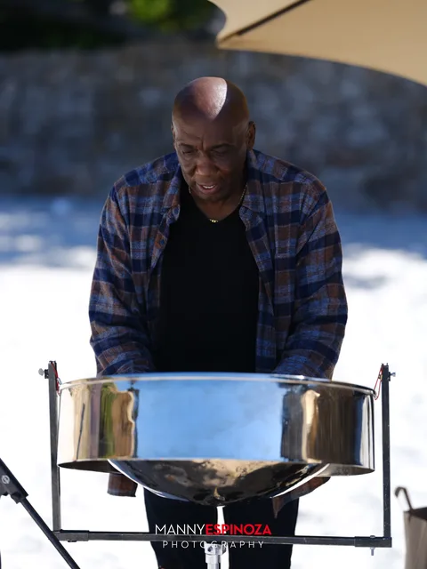 A steel drum player at his pan on the sand at Walk for Freedom 2026 on Carmel Beach